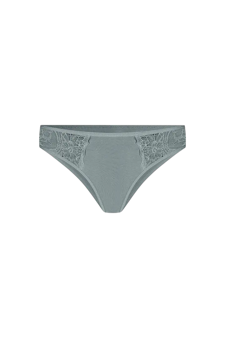 Panty tanga unicolor con laterales en encaje Diane & Geordi, color verde fondo transparente